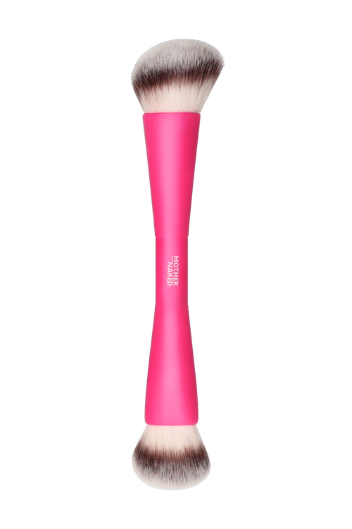 Makeup brush with pink handle on a white background