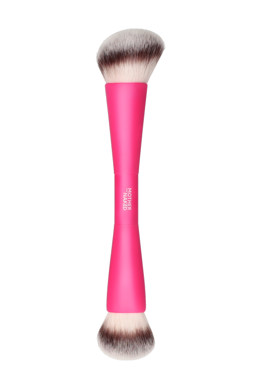 Makeup brush with pink handle on a white background